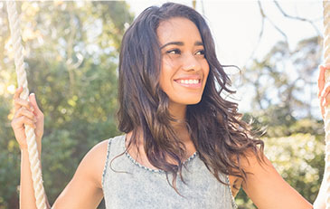 smiling woman while swing