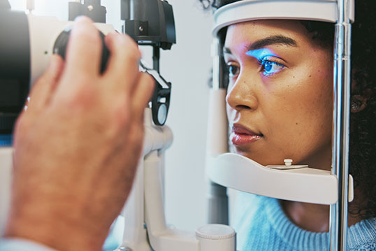 woman taking eye exam at Brooks Eye Associates