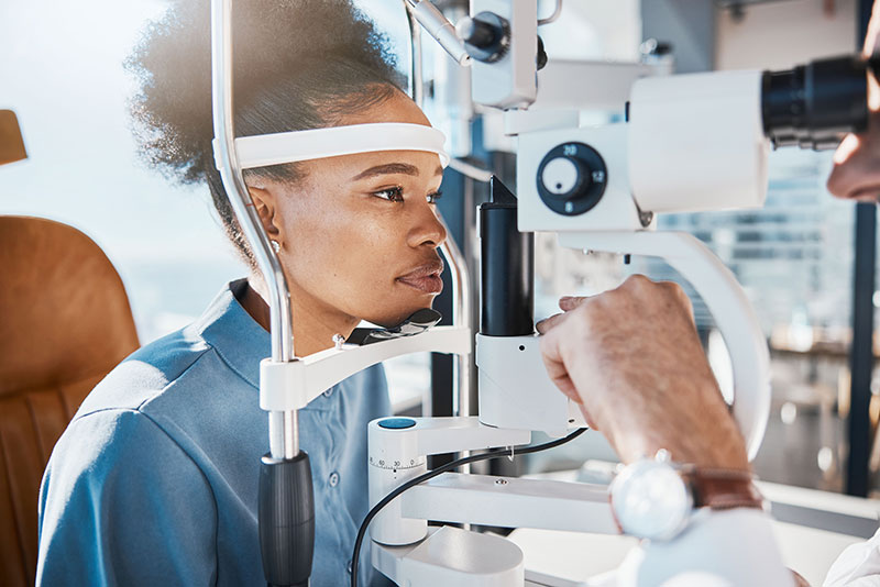 woman taking eye exam at Brooks Eye Associates