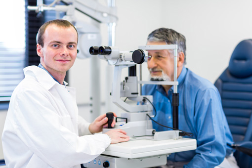 Eye Doctor examining patients eyes at Brooks Eye Associates